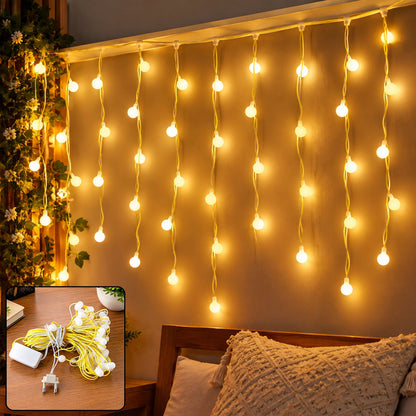 Curtain string lights hanging on a wall