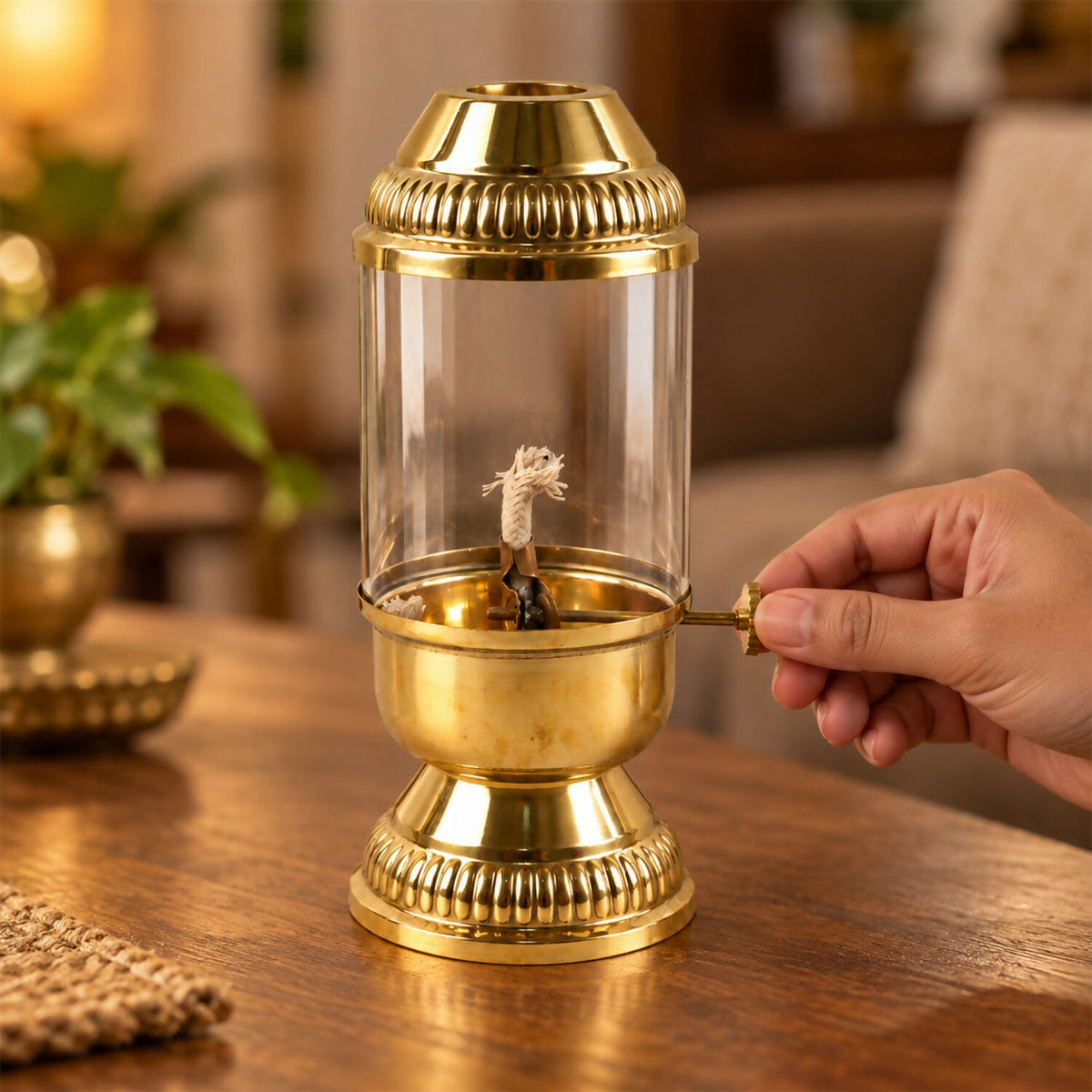 Brass akhand diya lit with glass chimney
