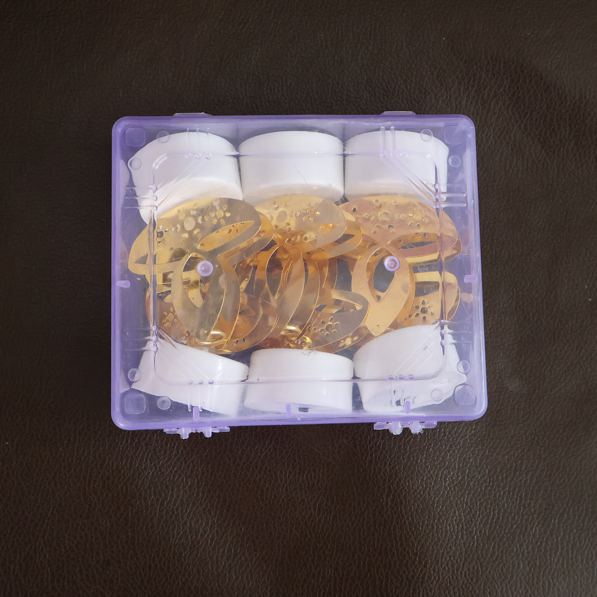 Golden diya LED tealights lit on a table