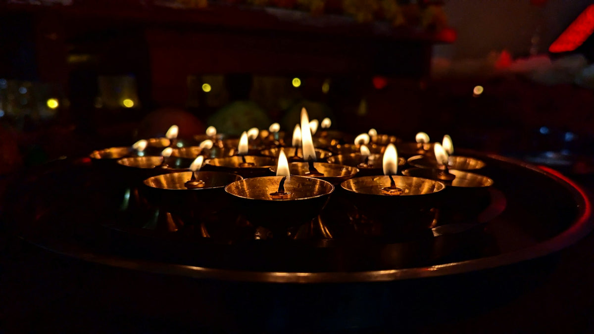 A group of lit diyas