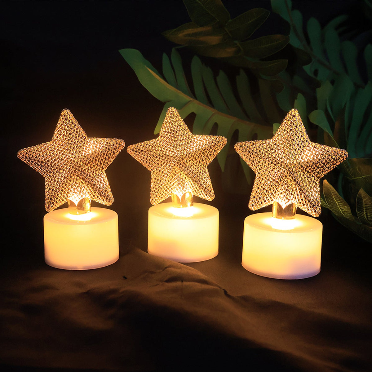Golden star LED tealights on display